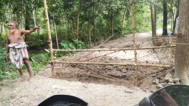 মধুখালীতে জনসাধারনের চলাচলের রাস্তা কেটে বেড়া দিলেন আব্দুল হাই মোল্যা